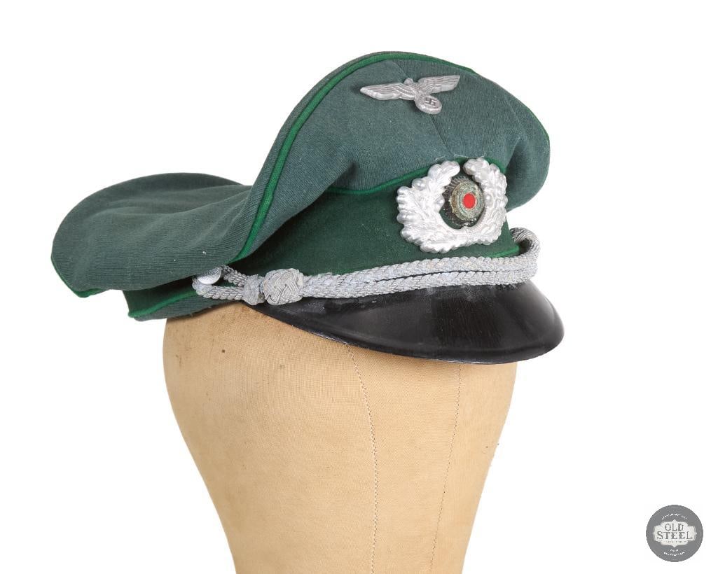 Original German Heer Gebirgsjager Official Oberleutnant Visor Cap WWII: German WWII Mountain Infantry Lieutenant's visor cap. Green band and light green piping. This well worn cap has no visible makers markings on the silk liner but beneath the headband is a