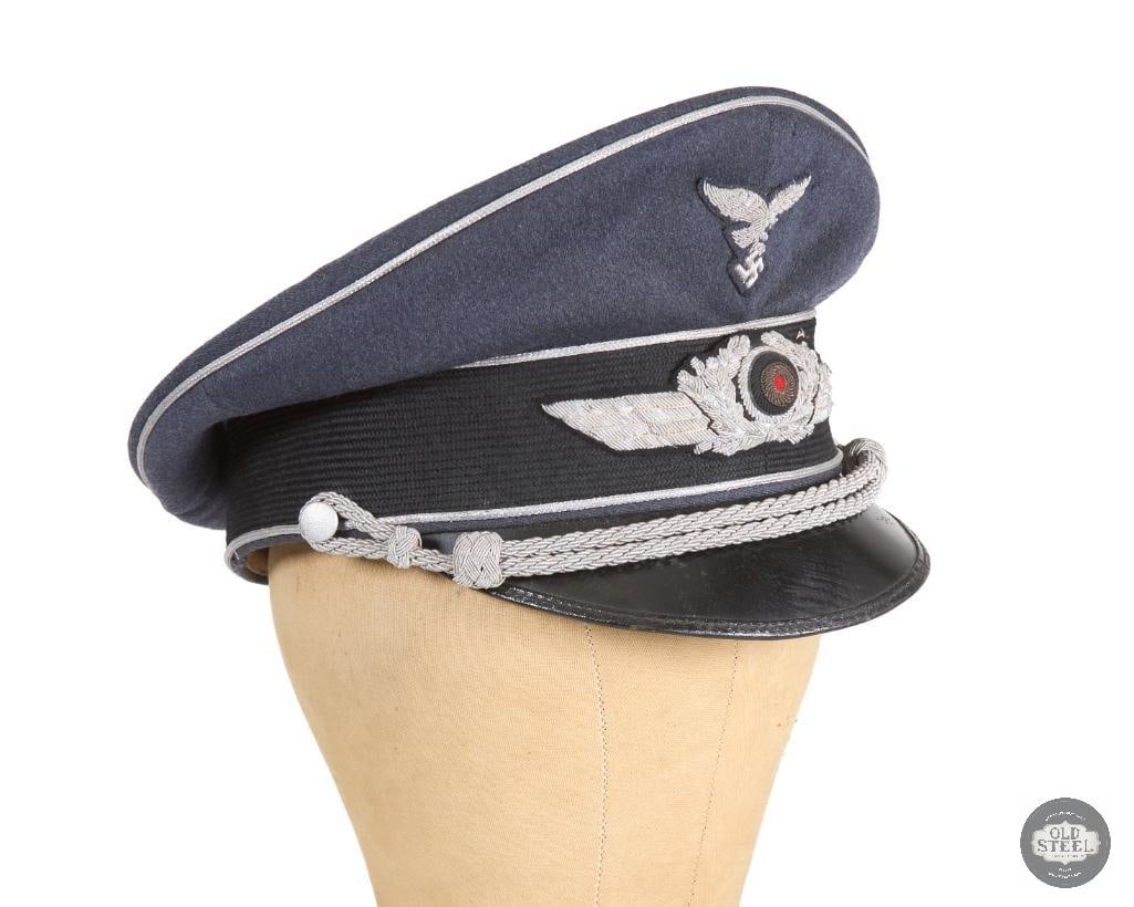 Original Luftwaffe Officer's Schirmmutze Visor Cap - Silver Piping and Braid - Germany WWII: Original Luftwaffe Officer's Schirmmutze Visor Cap - Silver Piping and Braid - Germany WWII. Some degradation to visor's connection at head band's sticking and to the leather of the headband itself on