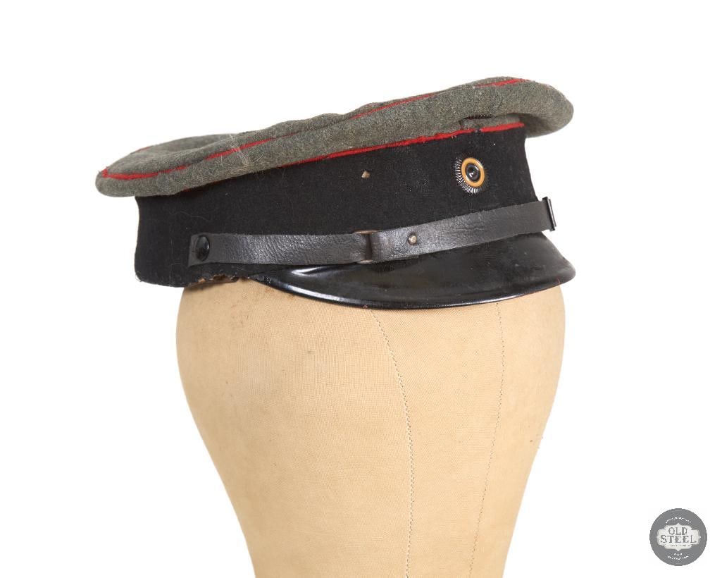 Original Imperial German Field Schirmmutze or Service Cap WWI: WWI Imperial German service cap with red piping, black band and green wool construction. THIS ITEM IS AS PICTURED WITH NO FURTHER ATTACHMENTS. ALL SALES ARE FINAL. PLEASE REFER TO THE