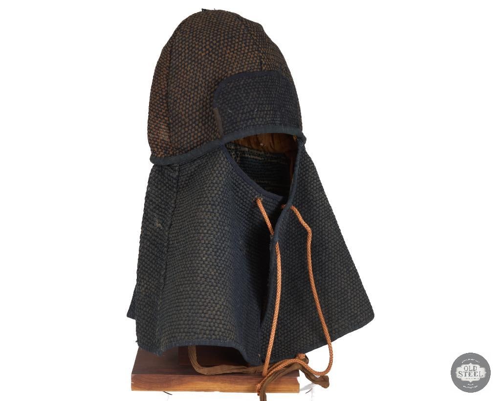 Original Japanese Hikeshi Zukin Firemans Hood: This piece has thick cloth cross stichting that increases padding and hold water. They would soak these in water to protect against inhalation of smoke/fumes and offer some protection from debris. App