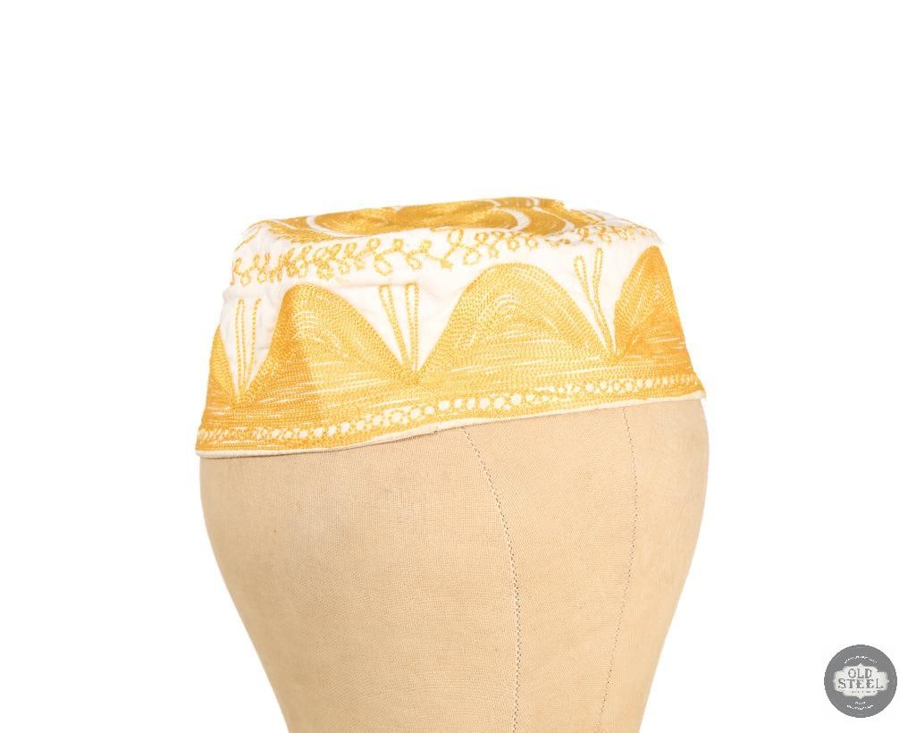 African Kufi Cap White with Gold Embroidery: African Kufi Cap White with Gold Embroidery THIS ITEM IS AS PICTURED WITH NO FURTHER ATTACHMENTS. ALL SALES ARE FINAL. PLEASE REFER TO THE AUCTION DES