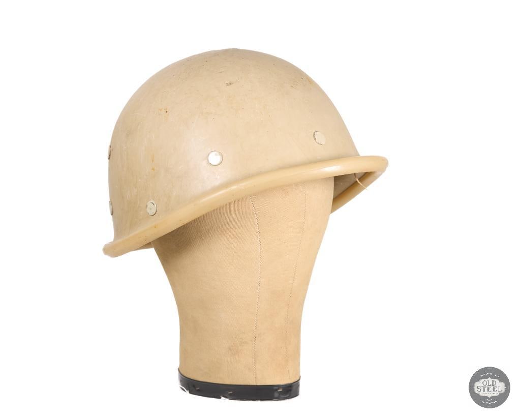 Iraqi M80 Light Plastic Helmet with Rubber Edge Cover: A Gulf War era Iraqi M80 helmet (no chinstrap) with a rubber edge cover. THIS ITEM IS AS PICTURED WITH NO FURTHER ATTACHMENTS. ALL SALES ARE FINAL. PLEASE REFER TO THE AUCTION