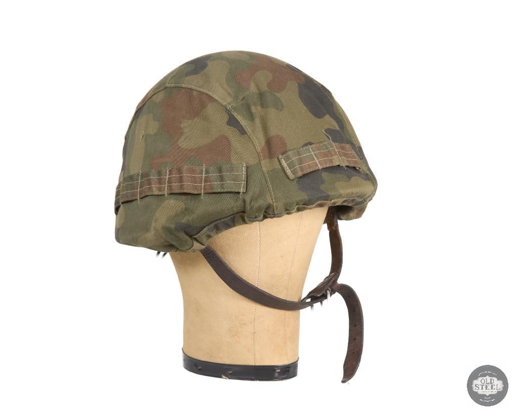 Polish Wz67 Helmet with Cover: This helmet still has the silver eagle on the front of the shell under the cover. The cover has a tag indicating 2005 make. THIS ITEM IS AS PICTURED WITH NO FURTHER ATTACHMENTS. ALL