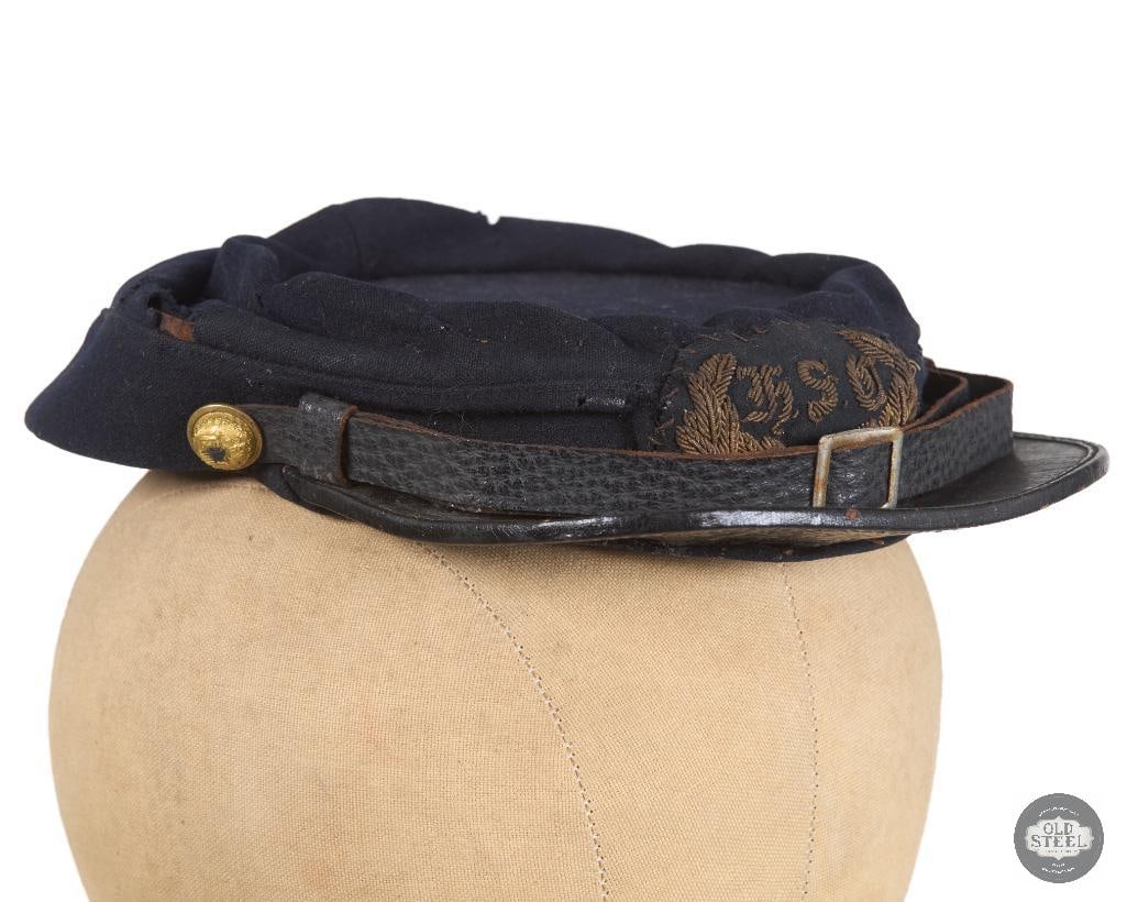 Original Civil War Union Horatio Seymour Cavalry Kepi: Civil War Union Army 13th "Horatio Seymour Cavalry" Cavalry Regiment Enlisted Kepi. Dark blue wool construction with black leather visor. "H.S.C" wreathed bullion cap insignia. Leather chinstrap with 