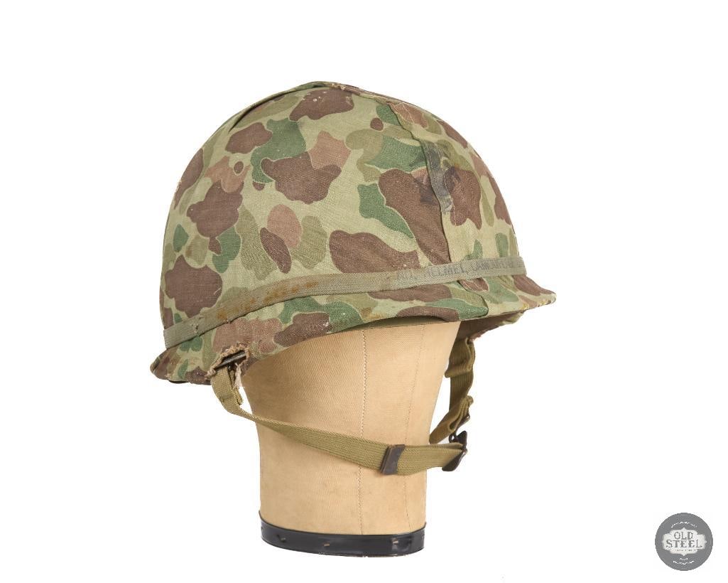 US Marines M1 Hood Helmet with Hood Rubber Co Liner with USMC Reversable Frogskin Camo 211C WWII: Here we have an M1 helmet with a rare Hood Rubber company made low pressure liner. The cover is a USMC marked reversible frogskin pattern. Inside of shell is stamped 211C indicating an earlier
