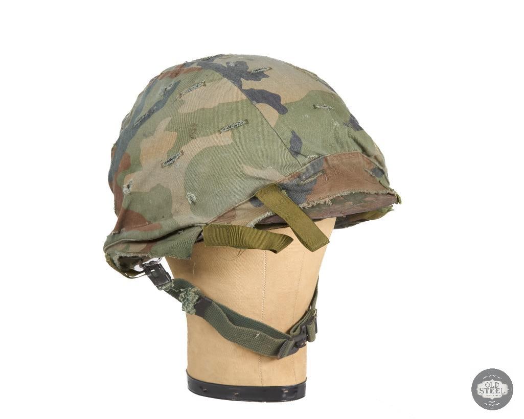 US M1 Helmet with Woodland Cover and Westinghouse Liner: US M1 helmet with cover. Suspension appears 80s-90s. THIS ITEM IS AS PICTURED WITH NO FURTHER ATTACHMENTS. ALL SALES ARE FINAL. PLEASE REFER TO THE AUCTION DESCRIPTION, LOT #1 DESCRIPTION