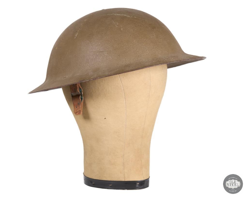 US M1917 Helmet -Original Paper Tag on Crown - WWI: A WWI US Doughboy's M1917 helmet. Liner and partial chinstrap present. Inside you can still see the instructions tag at the top of the crown. ZE 6 5 stamped on brim 