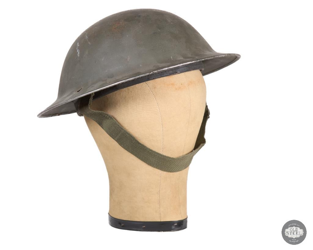 Canadian WWII Mk II Helmet: Canadian WWII Mk II Helmet THIS ITEM IS AS PICTURED WITH NO FURTHER ATTACHMENTS. ALL SALES ARE FINAL. PLEASE REFER TO THE AUCTION DESCRIPTION, LOT #1 DESCRIPTION AND TERMS OF SALE BEFORE