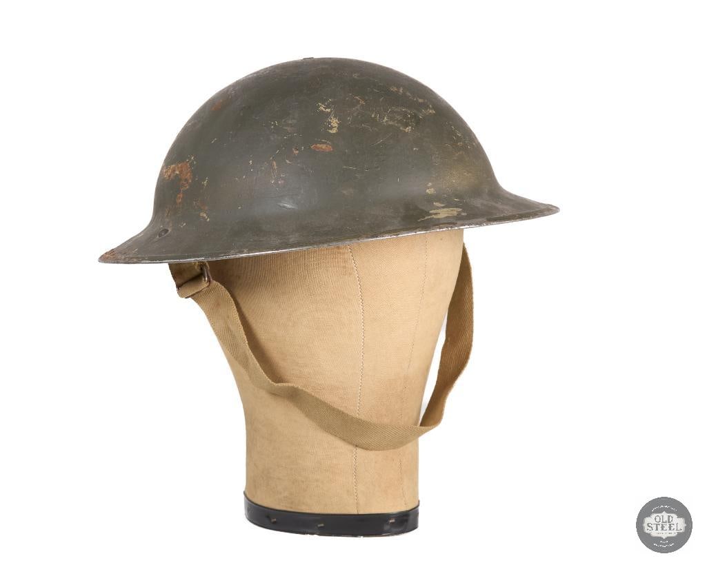 Mk II Brodie Helmet WWII: Here is a Mk II Brodie helmet with liner and chinstrap. Appears to be possibly Austrailian but heavy paint layers have completely obscured any potential markings in the steel. THIS ITEM IS AS