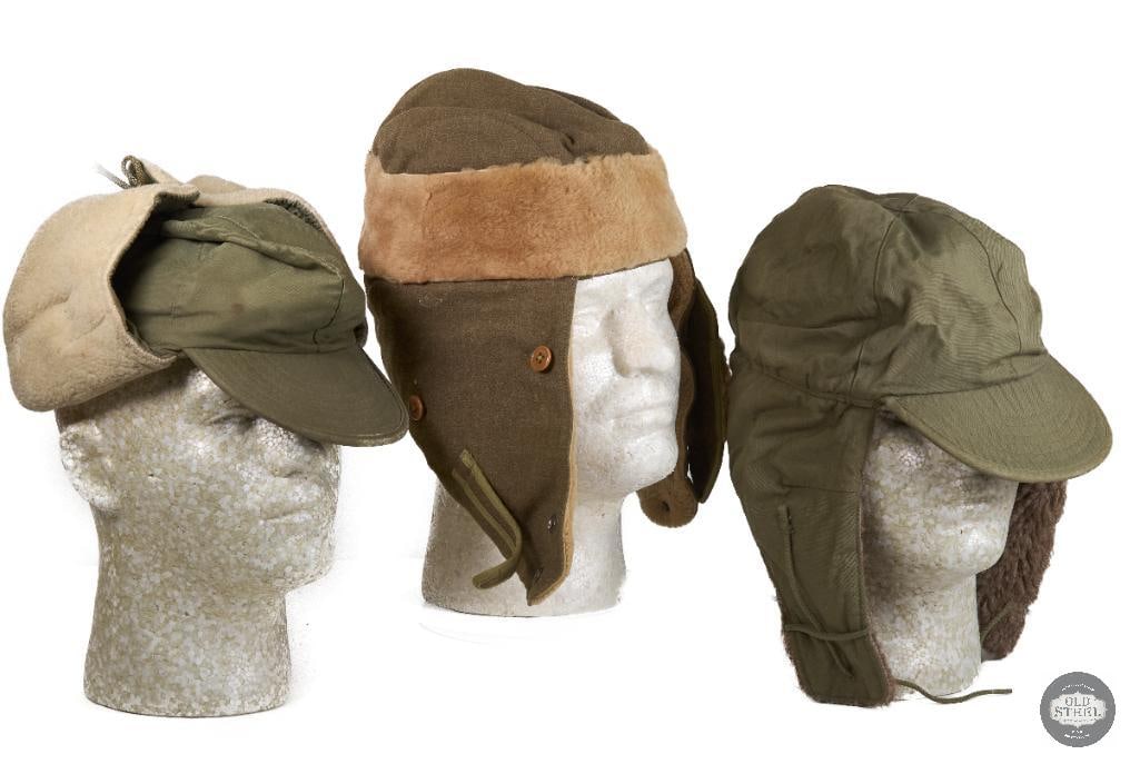 Trio of US Military Winter Caps: M1941 style WWII cap in the center and on the sides are 2 'Cap, Field Pile M1951' covers THIS ITEM IS AS PICTURED WITH NO FURTHER ATTACHMENTS. ALL SALES ARE FINAL. PLEASE REFER TO THE AUCTION