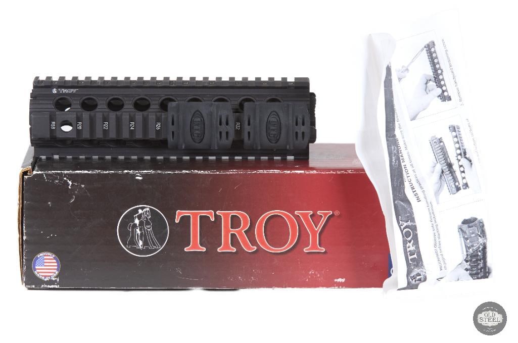 NIB Troy Industries 2-Piece Drop-In Mid-Length Quad Rail AR15 Handguard: Up for auction is a new in box Troy Industries 2-piece drop-in quad rail handguard designed for mid-length AR-15 platforms. Troy Industries is a well-known manufacturer of professional-grade AR