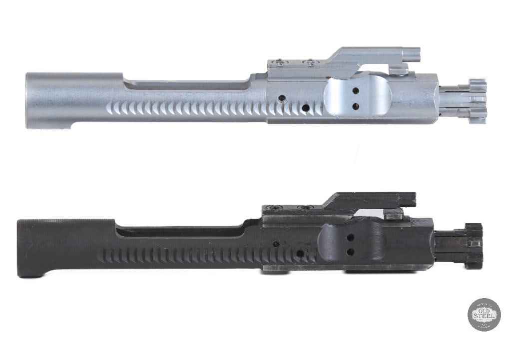 Lot of 2 AR15 Bolt Carrier Groups Chrome & Phosphate 5.56 NATO (.223): This lot includes two AR15 bolt carrier groups chambered for 5.56 NATO/.223 Remington, offering a versatile combination of finishes for different build preferences. The first is a chrome-finished BCG,