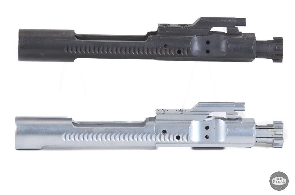 Lot of 2 AR15 Bolt Carrier Groups Chrome & Phosphate 5.56 NATO (.223): This lot includes two AR15 bolt carrier groups chambered for 5.56 NATO/.223 Remington, offering a versatile combination of finishes for different build preferences. The first is a chrome-finished