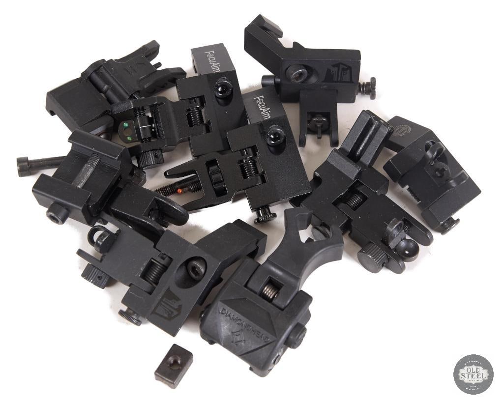 Lot of Various Picatinny Iron Sights AR15 Compatible Backup Sights: This lot includes a variety of Picatinny iron sights designed for AR15 and other compatible rifle platforms. The assortment features backup sight components suitable for mounting on standard Picatinny