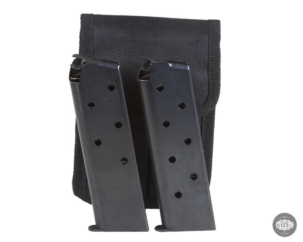 Lot of 2 7-Round .45 ACP 1911 Magazines with Black Nylon Magazine Pouch: This lot includes two 7-round .45 ACP magazines designed for standard 1911 pistols, along with a black nylon magazine pouch for convenient carry and storage. The magazines are built for reliable feedi