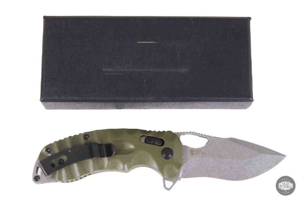 Green Sculpted G10 Flipper Knife with Box: This folding knife features a sculpted green G10 handle and a smooth flipper-style opening mechanism, combining practical everyday utility with an attractive, ergonomic design. The textured G10