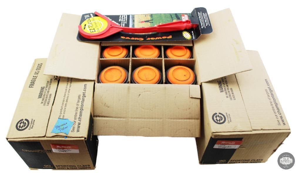 Lot of Shotgun Clays (3 Boxes) & Clay Target Thrower: This lot includes three boxes of shotgun clay targets along with a clay target thrower, providing a complete setup for clay shooting practice and recreational use. The clay targets are designed for