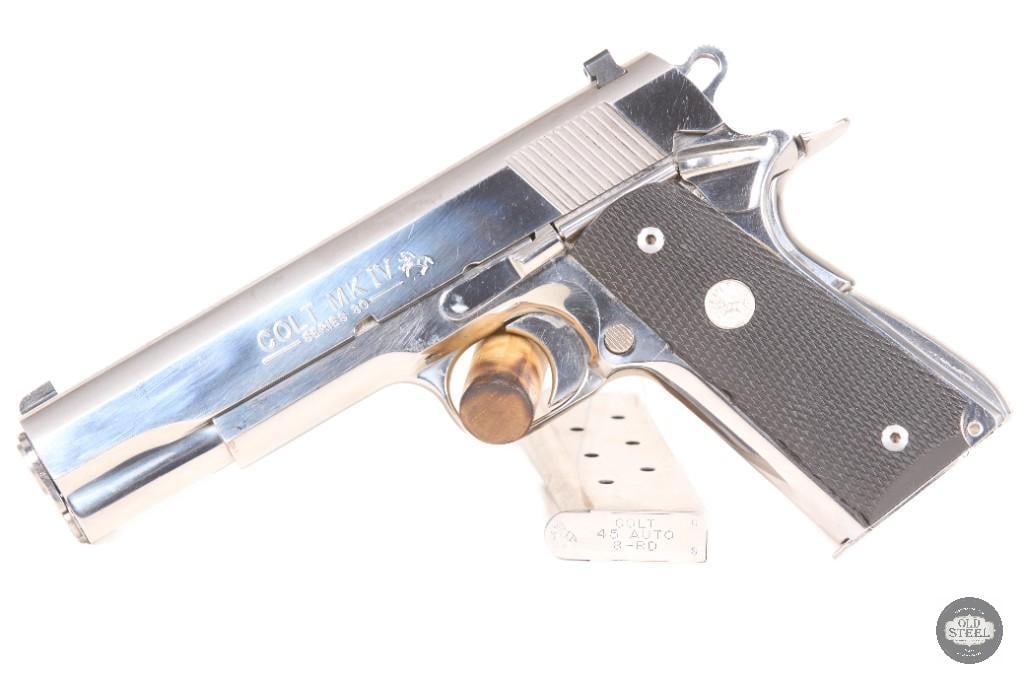 Colt 1911 MK IV Series 80 Government Model 45 ACP MFG 1997 W/ 2 Mags: Up for auction is a USA-made Colt 1911 Series 80 MK IV Government Model chambered in .45 ACP. This pistol features a high polish stainless finish with custom engravings on the slide, giving it a