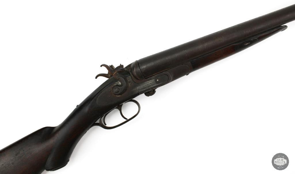 J.P. Clabrough & Bros 12 Ga Antique Hammer Double Black Powder Shotgun: This J.P. Clabrough & Bros double barrel shotgun is a 12 gauge black powder cartridge firearm featuring 29.5-inch barrels, a 14.5-inch length of pull, exposed hammers, and a break-open action. Man