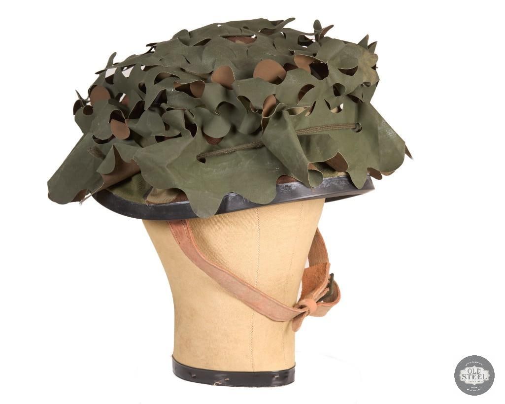 French Army Steel Helmet w/ Camouflage Cover & Reversible Scrim Cover: This French Army steel helmet comes complete with its suspension system and chinstrap. It includes both a camouflage helmet cover and a reversible scrim cover, making it a versatile field setup. The