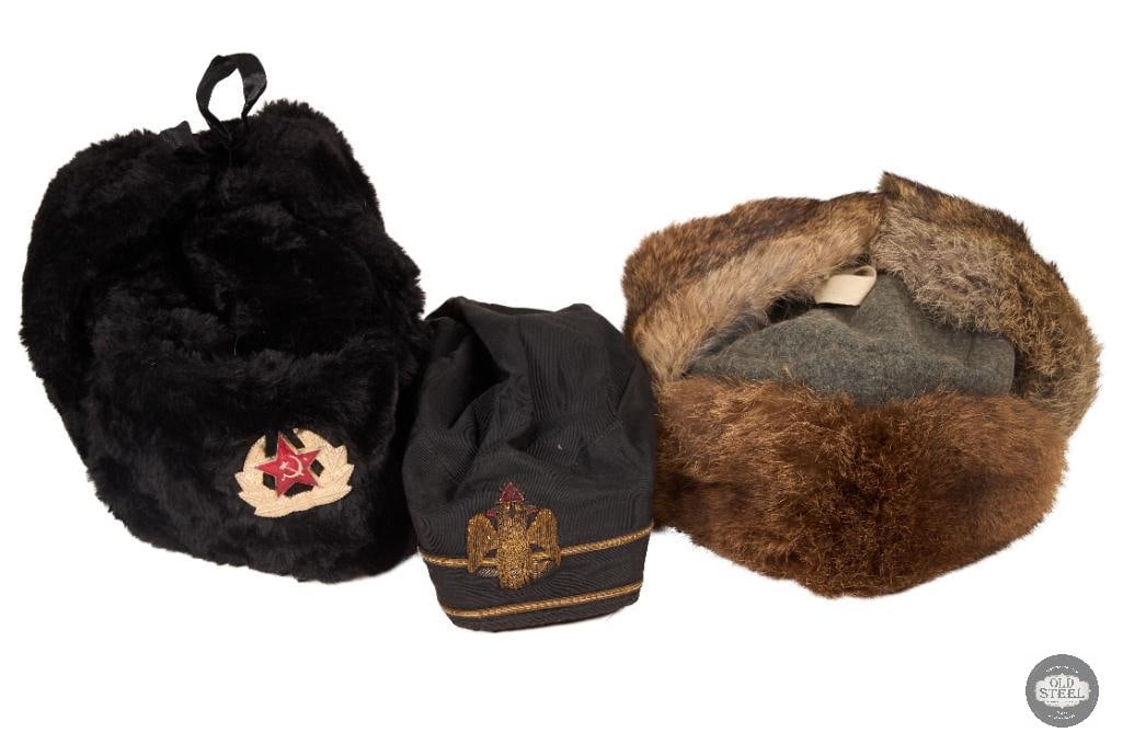 Lot of 3 Military Hats 2 Ushanka Style Cold Weather Caps & 1 Soft Cover: his lot includes three military-style hats consisting of two ushanka-style cold weather caps and one soft cover cap. The items are in used condition with normal signs of wear consistent with age and