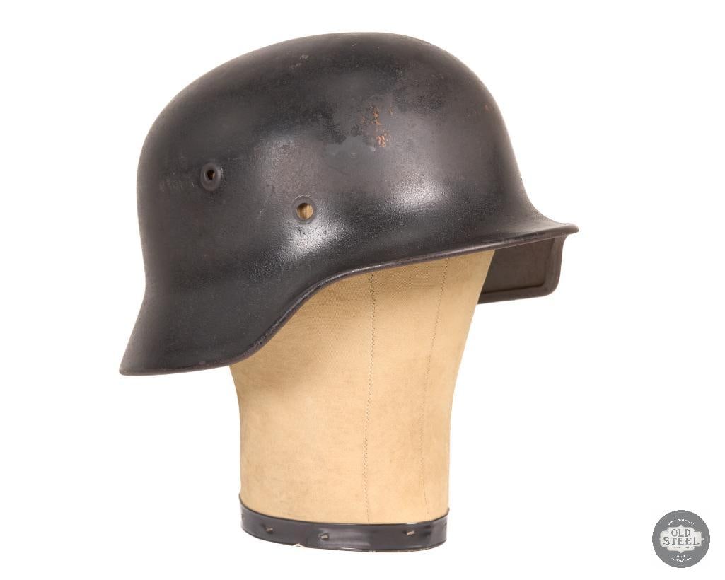 Original WWII German M40 Stahlhelm Luftwaffe Decal Helmet Shell Relic Display: This original German M40 Stahlhelm is a steel helmet shell featuring a faded Luftwaffe decal. The helmet no longer retains its liner or chinstrap and is offered as a shell-only example. The exterior