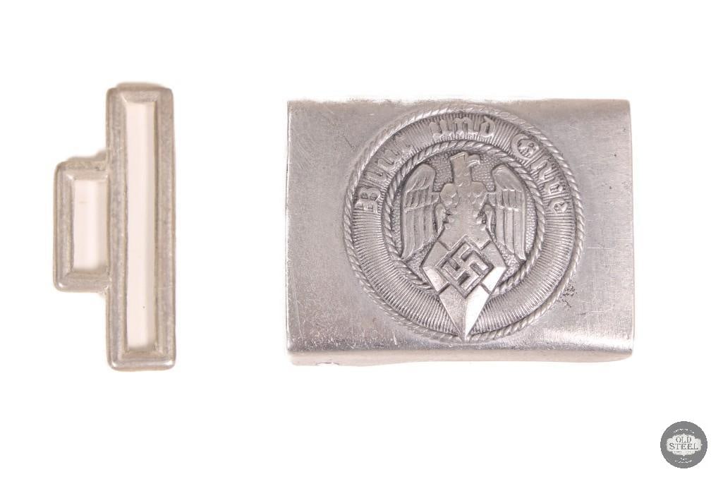 WWII Era German Hitler Youth Aluminum Belt Buckle HJ Emblem: This WWII-era German Hitler Youth belt buckle is constructed of aluminum and features the traditional HJ emblem design. The buckle shows age-related wear consistent with period use, including surface 