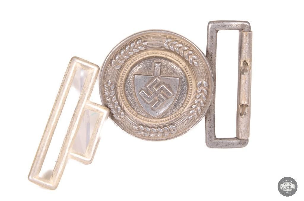 Original WWII German RAD Circular Belt Buckle Reich Labor Service: This original WWII German RAD circular belt buckle is associated with the Reich Labor Service uniform system. The buckle features the distinctive circular design and shows age-related wear consistent 