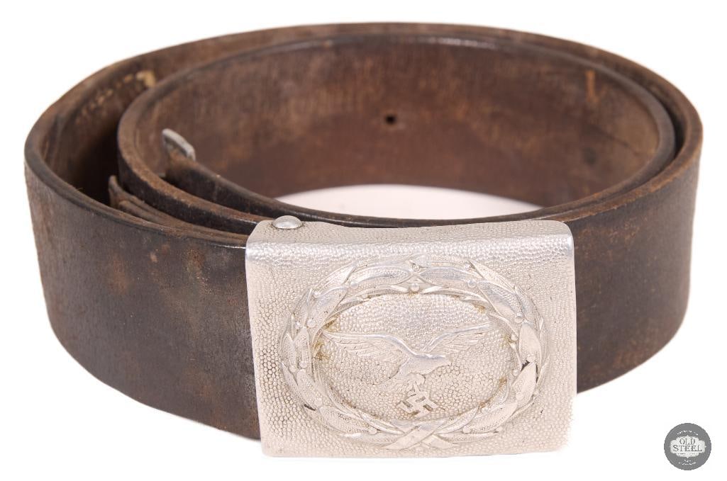 Original WWII German Luftwaffe EM/NCO Belt & Buckle Set: This original WWII German Luftwaffe EM/NCO belt and buckle set is a period-issued uniform component. The set includes the belt and matching buckle, both showing age-related wear consistent with