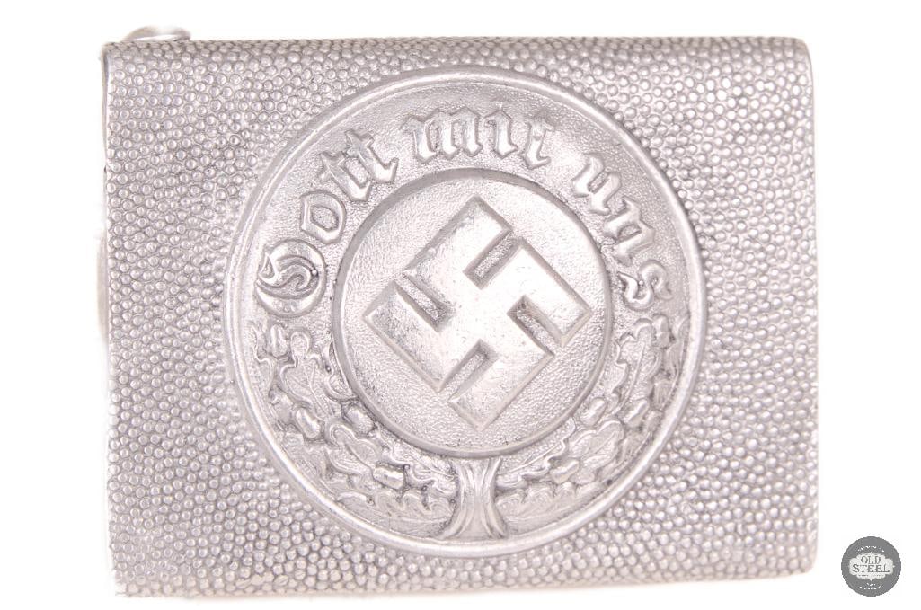 Original WWII German Police Belt Buckle (Schutzpolizei Era): This original WWII German police belt buckle is a period uniform component associated with German police service equipment. The buckle shows age-related wear consistent with use and storage,