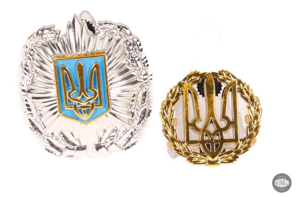 Ukrainian Silver Police Cap Badge & Tryzub Trident Pin Set: This set includes a Ukrainian silver-tone police cap badge along with a separate Tryzub (trident) pin. Both items show light age-related wear consistent with handling and storage, and remain in good
