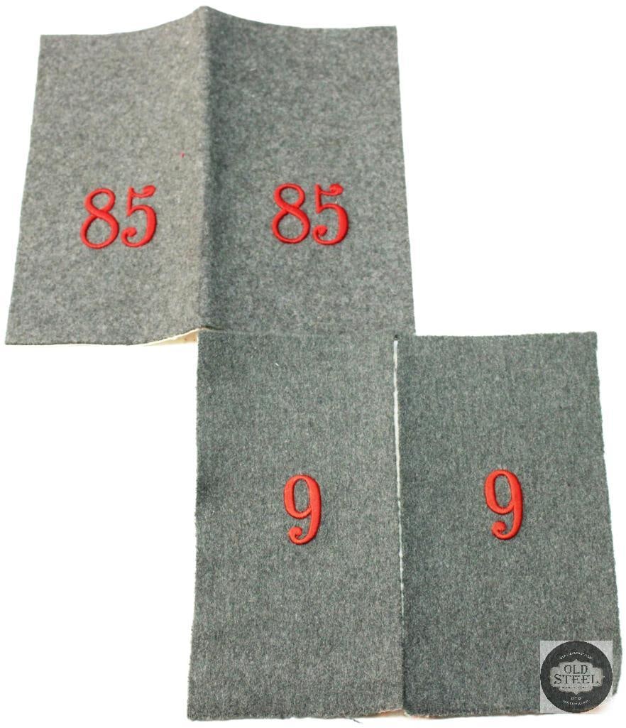 Imperial German Regimental Shoulder Boards: These are Imperial German regimental shoulder boards, commonly used during WWI to identify a soldier's unit. The red embroidered numbers, such as "85" and "9", represent the specific regiment or assig