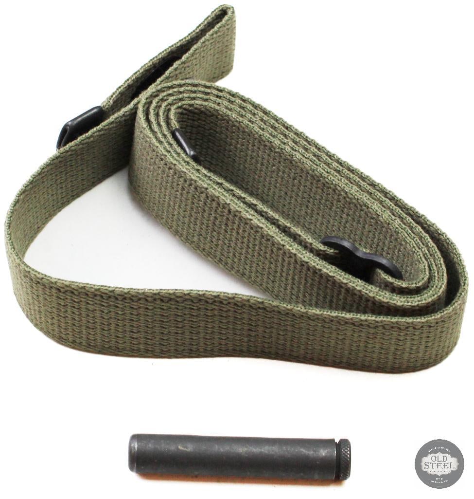Green M1 Carbine Canvas Sling w/ Leather Tabs & Oiler U.S. Military: This green canvas M1 Carbine sling features leather attachment tabs and includes a matching oiler. The sling shows age-related wear and handling marks consistent with military use and long-term