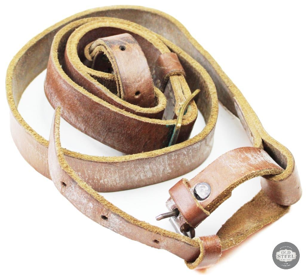 Rare All Leather Mosin Nagant M91/30 Rifle Sling Military Surplus: This rare all-leather Mosin Nagant M91/30 sling is an original military surplus accessory designed for use with the M91/30 rifle platform. Constructed entirely of leather with steel hardware fittings,