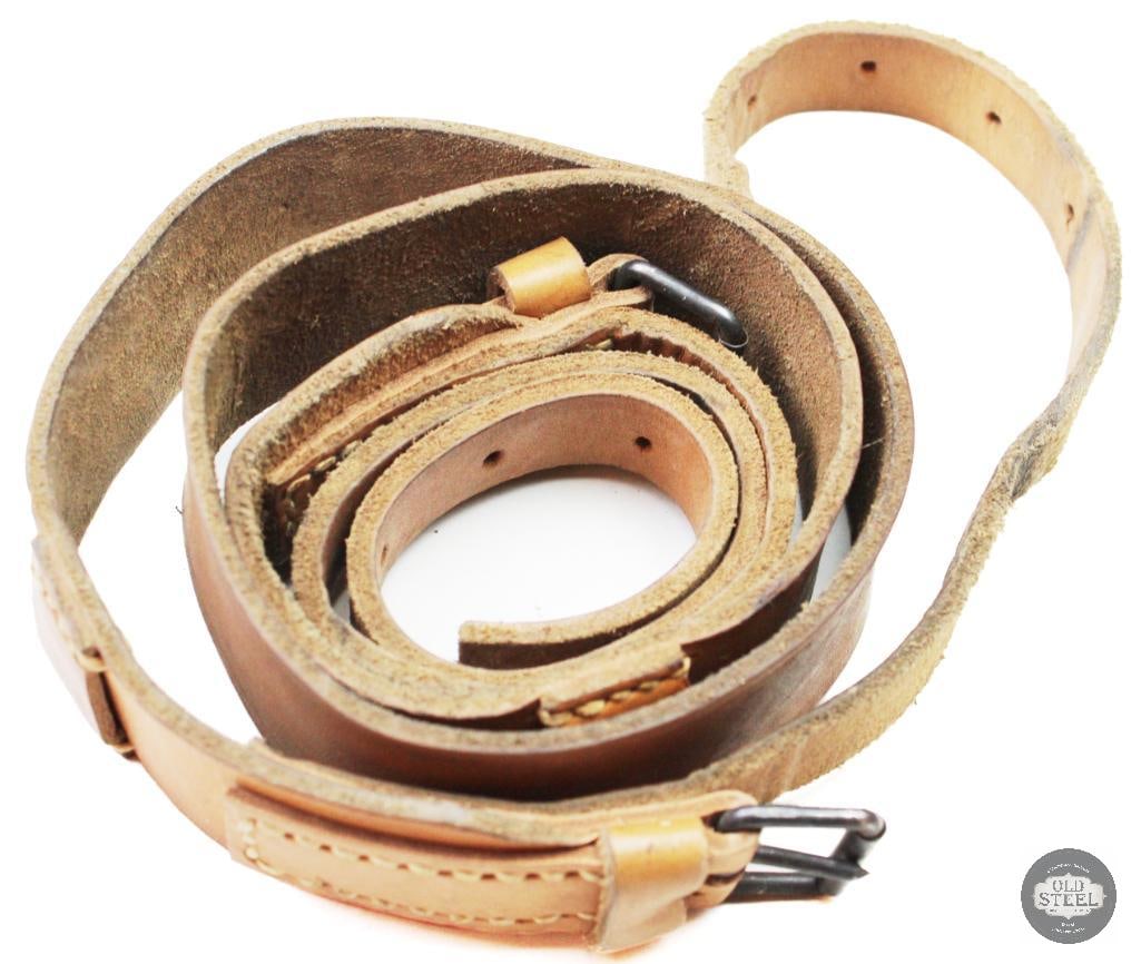 Unknown Leather Rifle Sling Possible Com-Bloc Style Military Accessory: Unknown leather rifle sling in possible Com-Bloc style construction. Made of leather with metal hardware fittings, the sling shows age-related wear, handling marks, and patina consistent with
