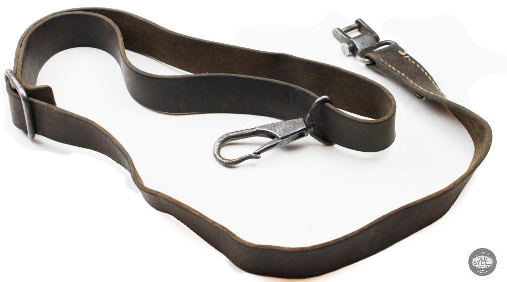 Original WWII German MG34 Leather Machine Gun Sling: Original MG34 leather machine gun sling constructed of leather with metal hardware fittings. The sling shows age-related wear, handling marks, and patina consistent with military use and long-term sto