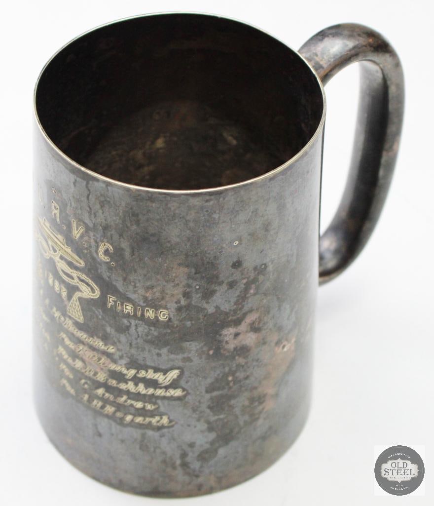 Vintage Pewter Mug: This appears to be a vintage pewter mug featuring engraved text related to the "O.U.R.V.C." and "FIELD FIRING 1888". The engraving lists multiple names, starting with "Sergt. A.A. McIlwaine". The