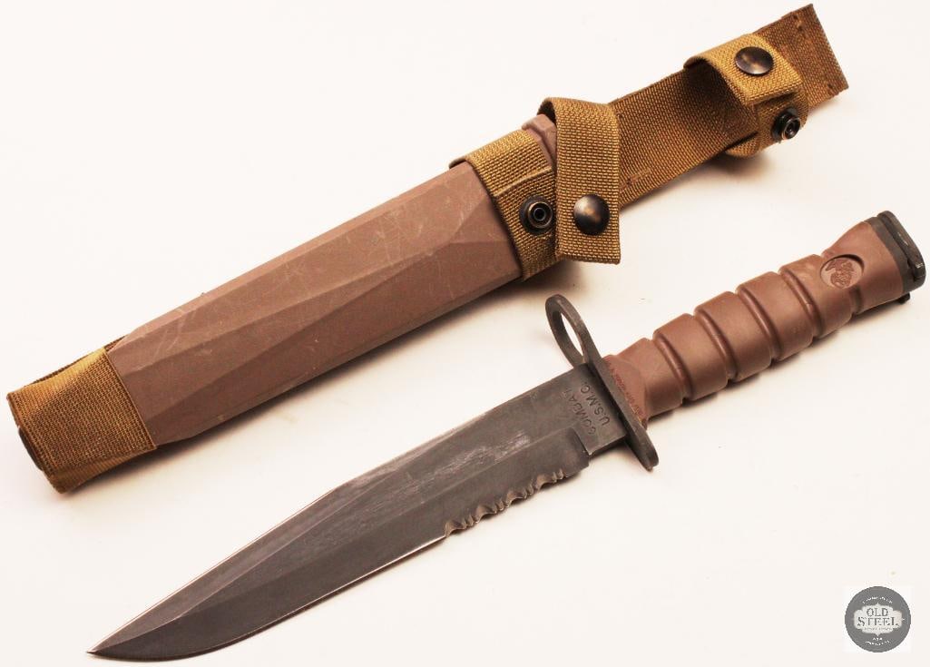 Original Ontario Knife Co. Issued USMC Bayonet w/ Scabbard: Original Ontario Knife Company issued USMC bayonet complete with its original scabbard. The bayonet features the rugged construction and design associated with modern U.S. Marine Corps service, with