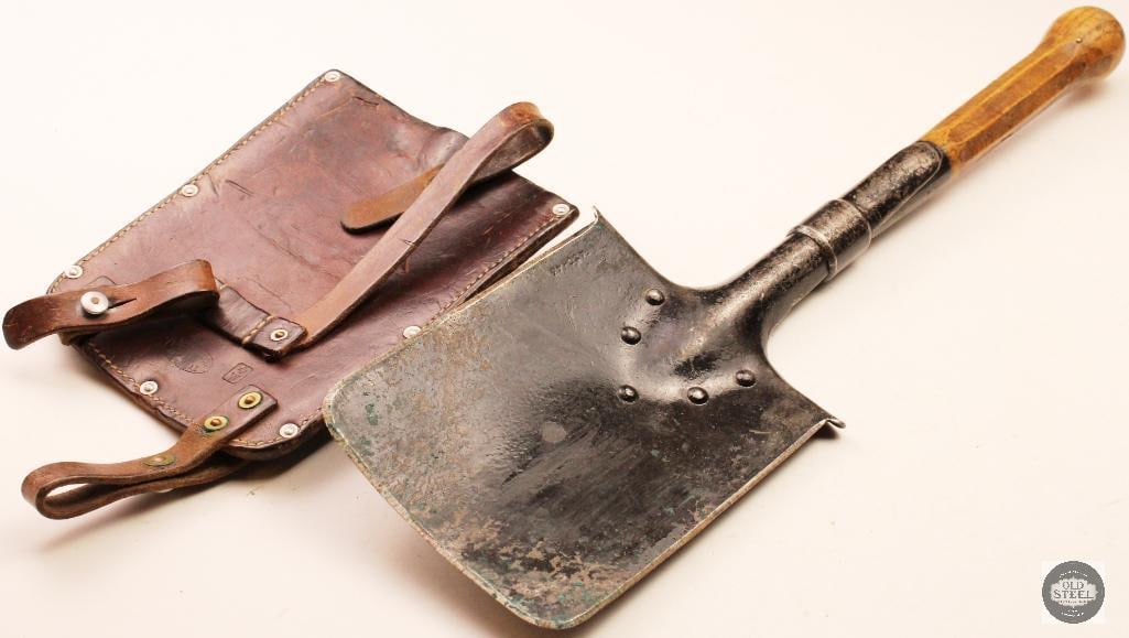 Original WWI/WWII Swiss Entrenching Shovel w/ Leather Scabbard: Original Swiss military entrenching shovel complete with its leather scabbard. The shovel features the classic compact field design used by Swiss forces during the World War I and World War II eras. I