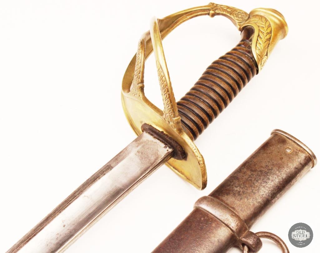 Original French Model 1822 Cavalry Sabre w/ Scabbard: Original French cavalry sabre complete with its scabbard and marked 1822 on the spine. The sword features the classic curved blade and brass hilt associated with the French Model 1822 cavalry