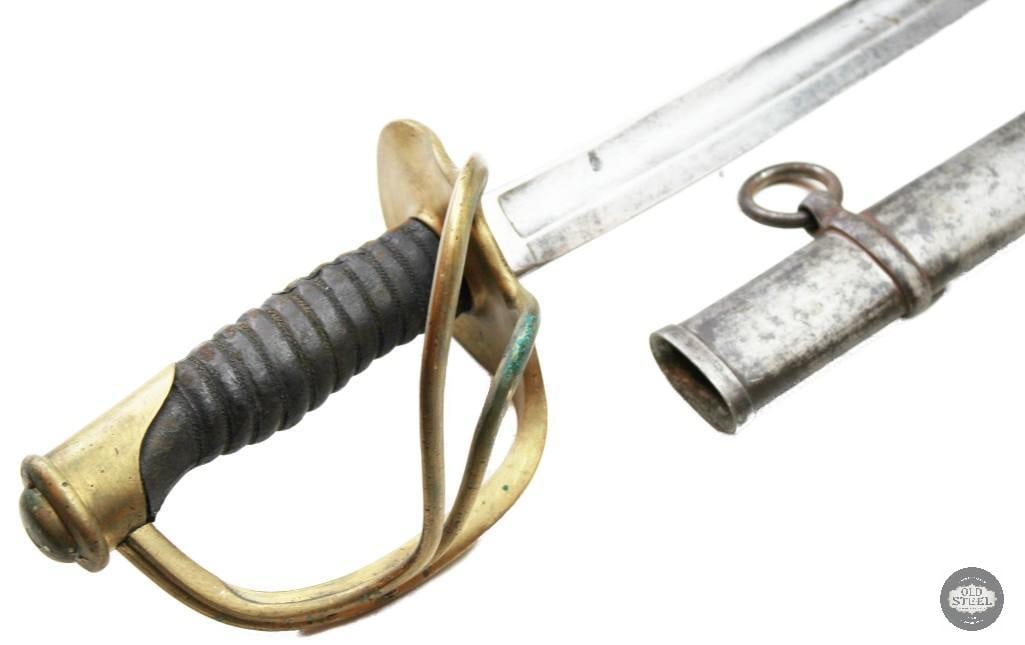 French Style Vintage Cavalry Sword 35 Blade w/ Scabbard: Vintage French-style cavalry sword featuring a 35-inch curved blade and accompanied by its scabbard. The sword displays age-related wear, handling marks, and patina consistent with long-term storage
