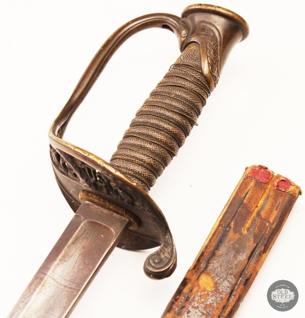 US Model 1850 Staff and Field Officers' Sword: US Model 1850 Staff and Field Officers' Sword accompanied by its original leather scabbard, heavily utilized during the American Civil War. The sword is in battlefield relic condition, showing a