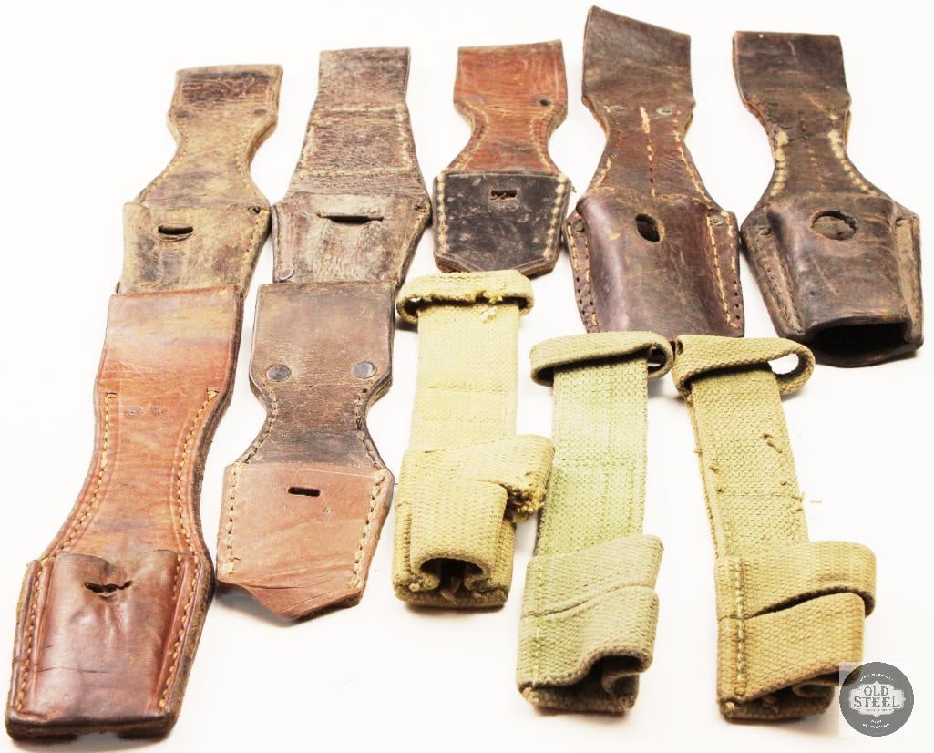 Assorted Military Bayonet Frogs: These appear to be vintage German military bayonet frogs , with some examples in leather and others in web canvas material.The leather frogs are consistent with WWII-era K98 Mauser bayonets , often