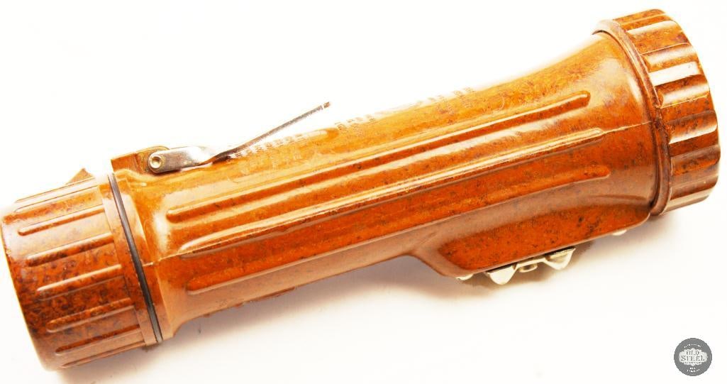 Fulton Mfg. Corp Bakelite flashlight: This is a vintage Bakelite flashlight approved by the U.S. Bureau of Mines and manufactured by Fulton Mfg. Corp. It features a distinctive brown mottled or marbled casing made from Bakelite, an early