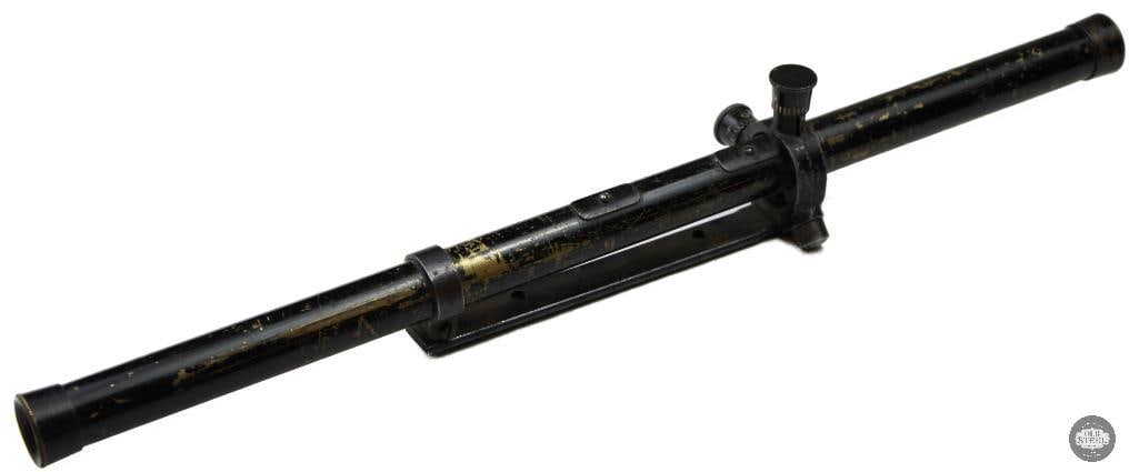 3/4-inch tube rifle scope and mounting rail: Vintage 3/4-inch tube rifle scope and mounting rail dating from the 1930s to the 1940s, structurally consistent with early commercial target and rimfire scopes manufactured by brands like O.F. Mossber