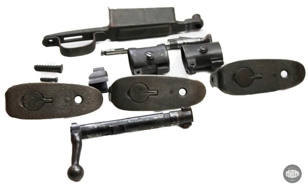 Assorted Vintage Military Rifle Parts: This set features components for a vintage military rifle, such as the Model of 1903 "Springfield".Key parts included are the bolt action mechanism, trigger guard assembly, and various butt plate