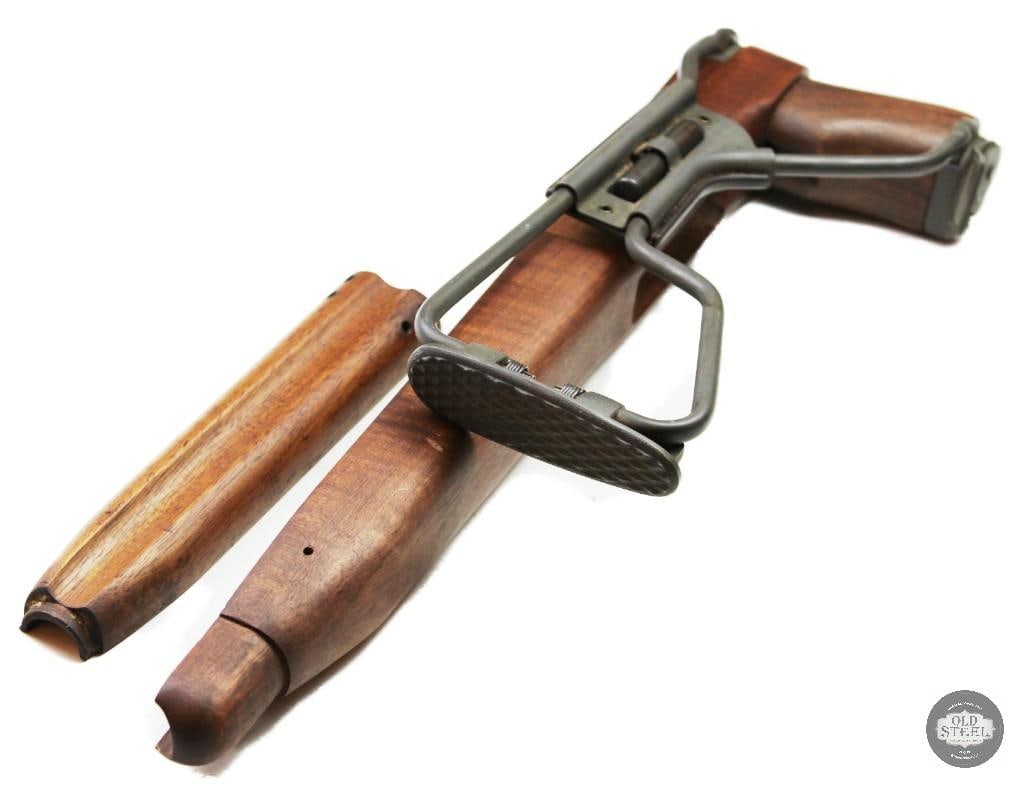 WWII/Korea Paratrooper style M1 Carbine folding stock: WWII/Korea Paratrooper style M1 Carbine folding stock. The assembly includes the walnut wooden stock, a metal folding buttstock mechanism, and a matching handguard. THIS ITEM IS AS