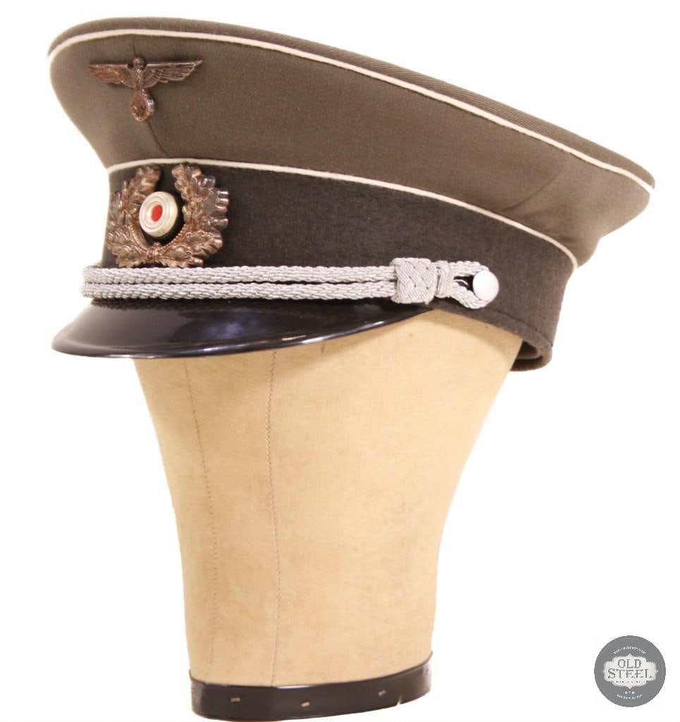 German Army Infantry Officer visor cap WWII Reenactors Piece: This WWII German Army Infantry Officer visor cap features a silver chin cord and embroidered insignia. Re-enactors piece Modern craftsmanship THIS ITEM IS AS PICTURED WITH NO FURTHER
