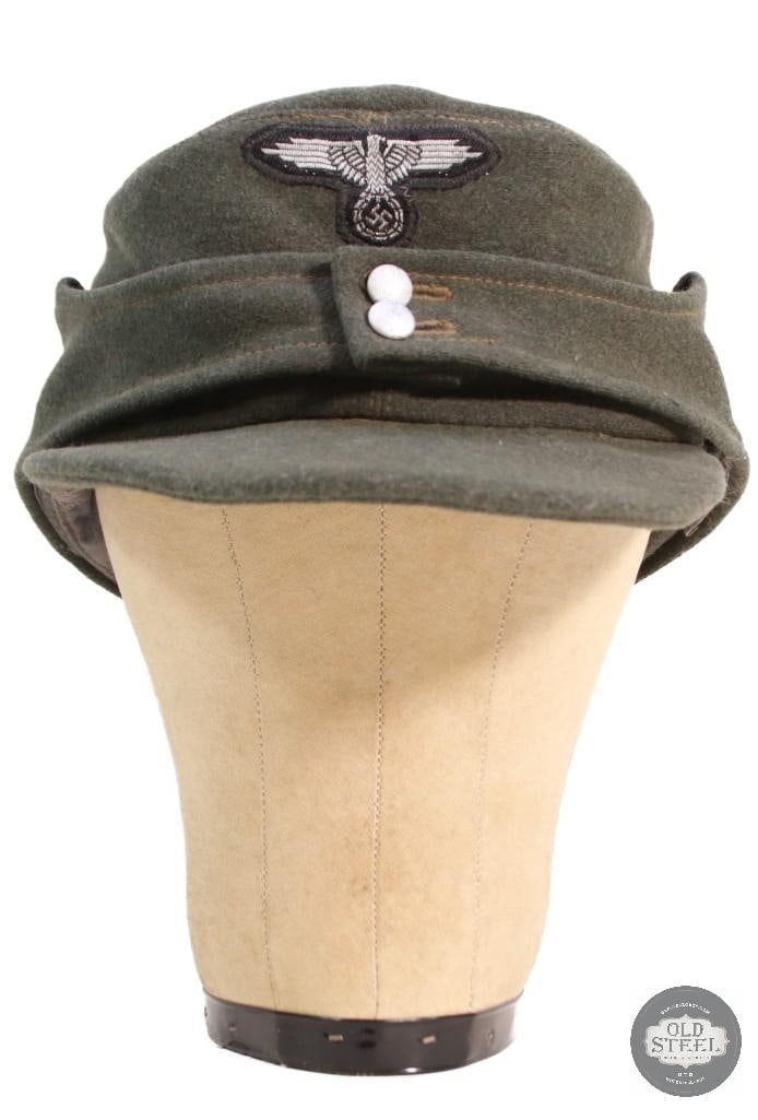 German M43 field wool cap Reenactors Headress: This item is a replica German M43 field wool cap featuring a prominent eagle badge pin. THIS ITEM IS AS PICTURED WITH NO FURTHER ATTACHMENTS. ALL SALES ARE FINAL. PLEASE REFER TO THE AUCTION