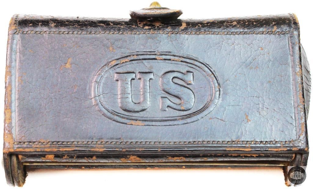 US M1874 McKeever Cartridge Box: This is an authentic US M1874 McKeever Cartridge Box , a leather ammunition pouch used by the US Army during the Indian Wars. The box was designed to hold 20 rounds of .45-70 caliber cartridges for th